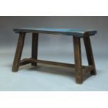 A rustic oak work bench, early to mid 20th Century, the rectangular top on square section supports