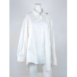 Balenciaga: an asymmetrical white cotton shirt with imitation gold button to the left shoulder, size