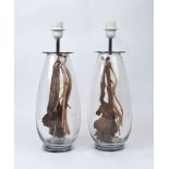 A pair of modern glass table lamps, each with driftwood inserts, 38cm high (2) It is the buyer's