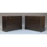 A pair of contemporary bedside chests, the rectangular leather covered tops above three graduated