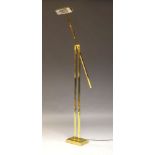 A brass adjustable standard lamp, c.1970, with adjustable counterbalance arm on rectangular plinth