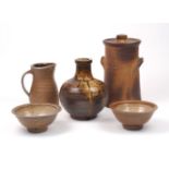 A selection of stoneware studio pottery, late 20th century, comprising a large jar and cover, 29cm