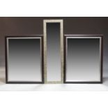 A pair of large contemporary rectangular wall mirrors and a further wall mirror, 101cm x 82cm and