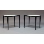 A pair of ebonised and vellum side tables, second half 20th century, the rectangular tops inset with