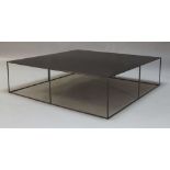 A contemporary industrial black painted steel coffee table, the square top on black powder coated