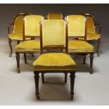 A Harlequin set of six mahogany dining chairs, mid-19th century, comprising pair of open arm elbow