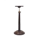 A George III mahogany adjustable candle stand, late 18th century, the circular top on a tapering