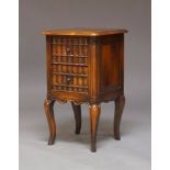 A reproduction mahogany bedside table, late 20th century, with two faux book fronted drawers on