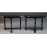 A pair of ebonised console tables, late 20th century, the shaped top above bobbin turned supports,