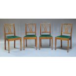 A George III style mahogany drop leaf dining table and four chairs, early 20th century, the