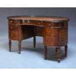 A mahogany kidney shaped pedestal desk, mid-20th century, the leather lined galleried top above