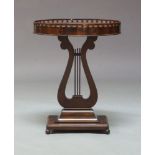 A Regency style mahogany occasional table, of recent manufacture, the top with a gallery edge,