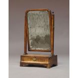 A George III walnut dressing table mirror, with rectangular plate over a single drawer, ogee front