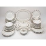A large Huguenot fine china service, late 20th century, comprising: two oval platters, 37cm wide,