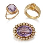 A group of jewellery, comprising: an Edwardian amethyst and half-pearl gold brooch, the central oval