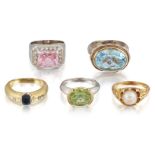 A group of five gem rings, comprising; An 18ct two colour gold, peridot single stone ring, the