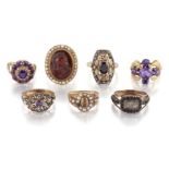 A group of seven various rings, comprising: a garnet and diamond cluster ring, the hexagonal