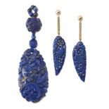 A Chinese carved lapis lazuli pendant and earrings, the pendant of oval form carved with flowers and