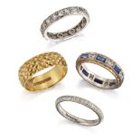 A collection of four band rings, one foliate engraved, ring size L, two set with colourless