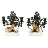 A pair of Regency gilt and bronze twin-light candelabra, c.1820, each modelled with a tree, the