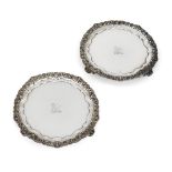 A pair of silver waiters by Paul Storr, London,1819, of circular form with scrolling foliate and