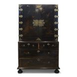 A Queen Anne black japanned cabinet on chest , c.1710, decorated throughout with trees, buildings,
