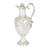 A Victorian silver ewer, London, 1869, Samuel Smily, the ovoid body repousse decorated with floral