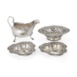 An 18th century Irish silver sauce boat, Dublin, 1787, Matthew West, raised on three shell-