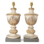 A pair of Italian painted and giltwood table lamps, early 20th century, each with fluted body and