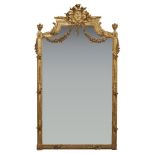 A French giltwood overmantel mirror, late 19th century, the pediment with central ribbon and