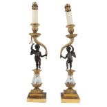 A pair of French gilt and patinated figural candlesticks lamps, late 19th century, each modelled