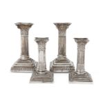 A pair of Victorian silver Corinthian column candlesticks, Sheffield, 1886, Hawksworth, Eyre &