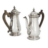 A pair of silver café-au-lait pots, London, 1932 & 1933, J. Parkes & Co., of baluster form with