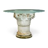 A white painted terracotta Corinthian column capital table, 20th century, with circular glass top,