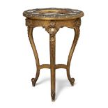 A French giltwood table, mid 19th century, on three shaped legs, the porcelain bowl top painted with