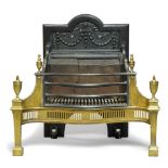 An Edwardian cast iron and brass fire grate, of George III style, early 20th century, with