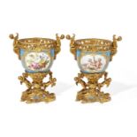 A pair of Sevres style gilt-bronze mounted porcelain potpourri vases, probably English, late 19th