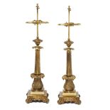 A pair of French gilt-bronze table lamps, early 20th century, each with reeded tapering shaft