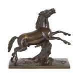 A French bronze model of a rearing horse, second half 19th century, on a naturalistic base with tree