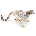 A Herend porcelain model of a running cheetah, late 20th/early 21st century, decorated in the fish