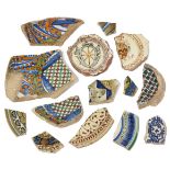 A collection of fourteen Italian Maiolica and incised slipware fragments, 14th - 16th century,