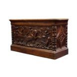 A Continental carved oak blanket box/coffer, 19th century, the hinged lid enclosing storage space,