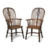 A pair of Victorian yew wood and elm Windsor armchairs, the high arching backs with turned