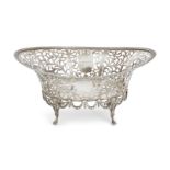 A pierced Edwardian silver bread basket, London, 1909, C. S. Harris & Sons, the oval body with