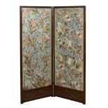 A mahogany two panel screen, c.1910, fitted with two silkwork panels depicting entwined flowering