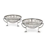 A pair of George V pierced silver dishes, London, 1916, Reid & Sons, each with circular floral and