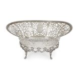 A pierced George V silver bread basket, London, 1918, C. S. Harris & Sons, the oval body with