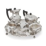 A five-piece silver tea service, Sheffield, 1946, Viner's Ltd., comprising shaped circular tray,