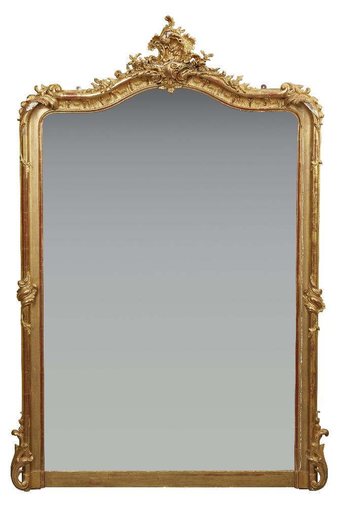 A French gilt overmantel mirror in Louis XV style with cartouche centred arching top over a bevel