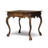 A Flemish oak side table, late 19th century, the rectangular top above chip carved frieze with